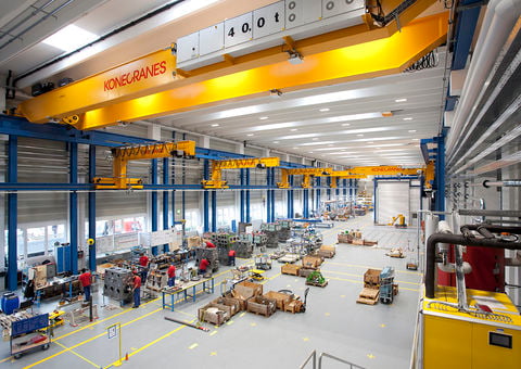 Overhead cranes in a manufacturing facility.